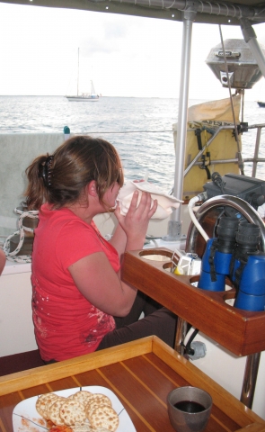 Amanda blowing the Conch Horn at sunset.