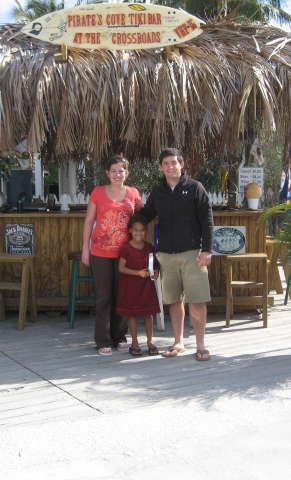 Amanda, Justin and a local kid at Great Guana.