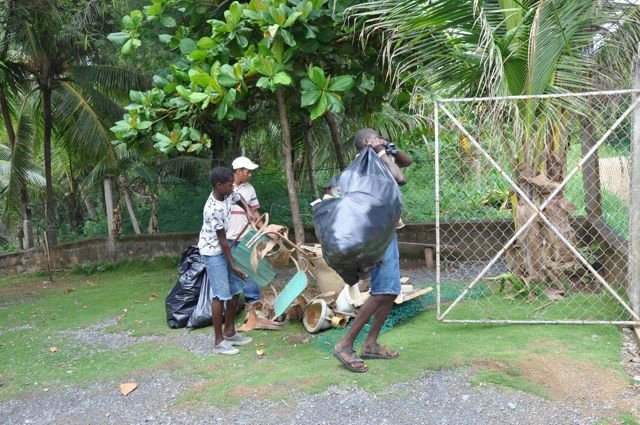 Cleaning the school yard.