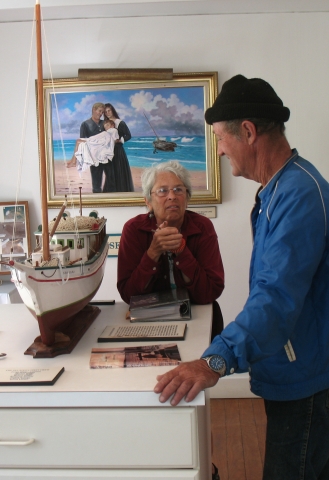 Jean (Amadon Light) gave us tour of the Spanish Wells Museum. Robert (Kool Breeze) listens intently.