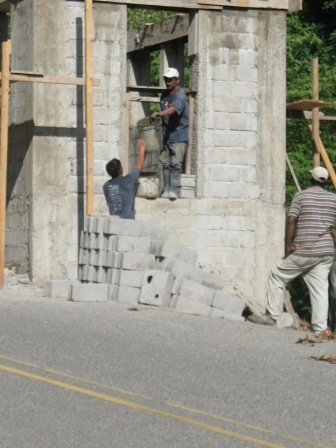 Hand bucketing cement up
for pouring. (HARD work).