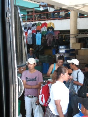 Busy market at bus station.