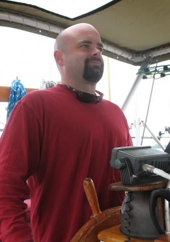 Mike at the helm heading out Charleston Harbor