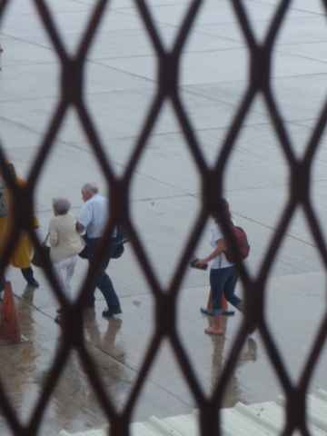 Em walking tarmac to plane